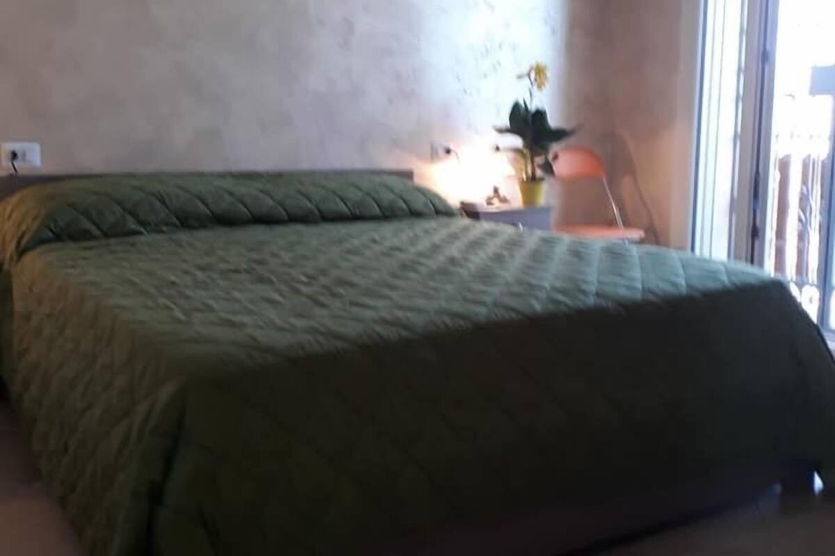 Habitación Deluxe, cocineta | Ropa de cama
