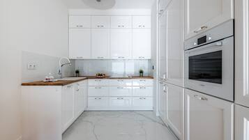 Departamento Premium | Cocineta privada | Refrigerador, horno, parrilla de estufa y lavavajillas