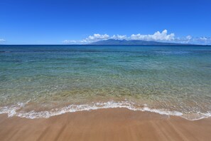 On the beach, sun loungers, beach towels