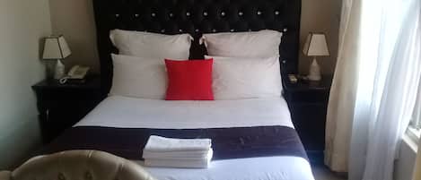 Premium bedding, down duvets, minibar, in-room safe