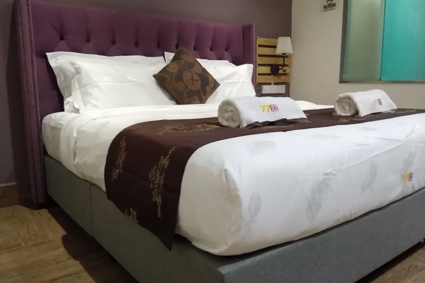 Deluxe Room, No Windows | In-room safe, desk, blackout drapes, free WiFi