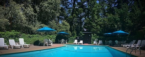 Seasonal outdoor pool, open 9:00 AM to 9:00 PM, pool umbrellas