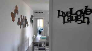 A hallway with a wall-mounted sign that reads 'Live Love Laugh.' - La Finestra sul mare (Marina Julia, Monfalcone,Italy)