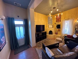 Premium Suite | Living area | 65-inch Smart TV with digital channels, TV, Netflix