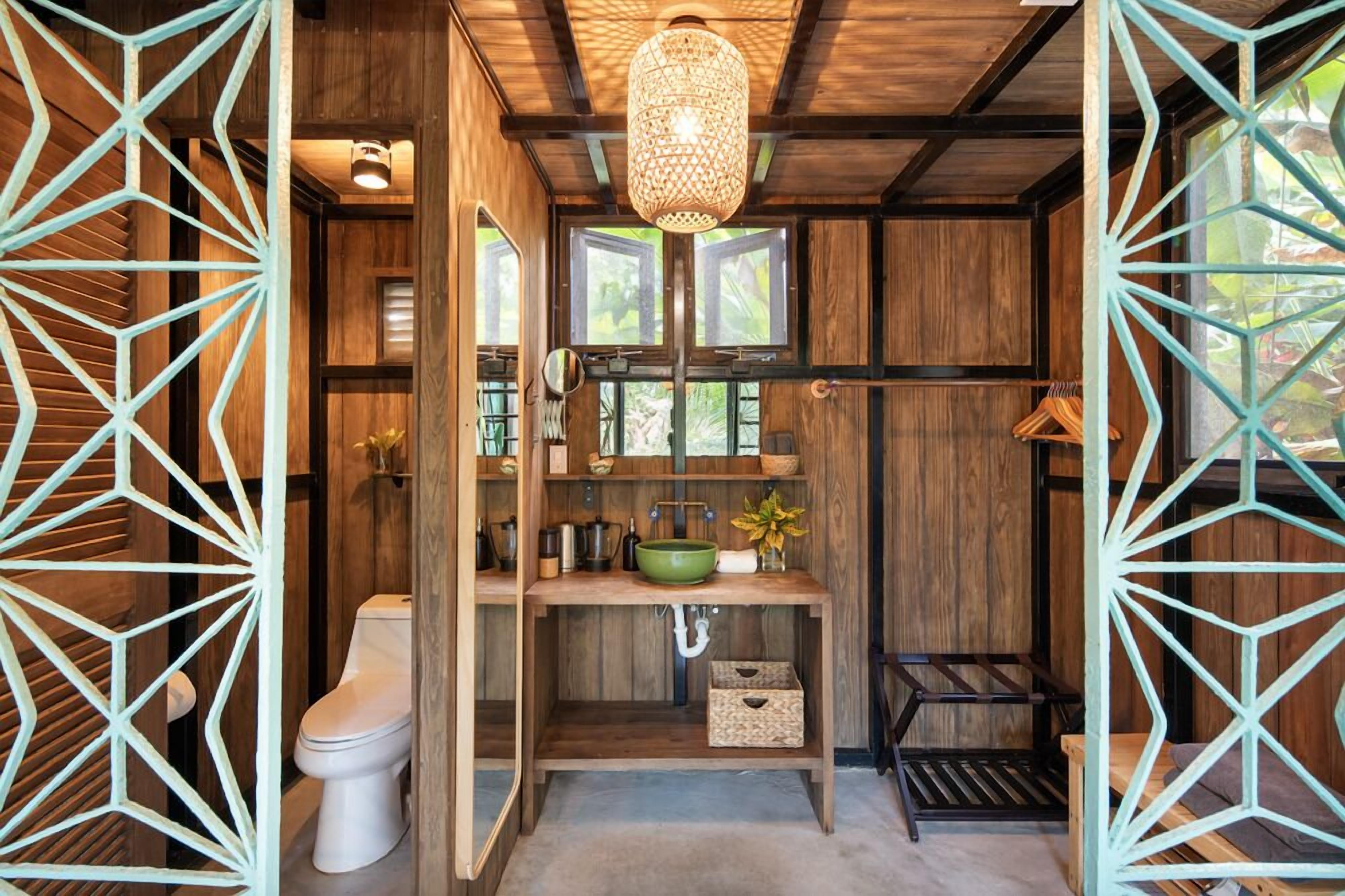 signature tree house, 1 queen bed, kitchen, garden view | bathroom | shower, free toiletries, hair dryer, towels