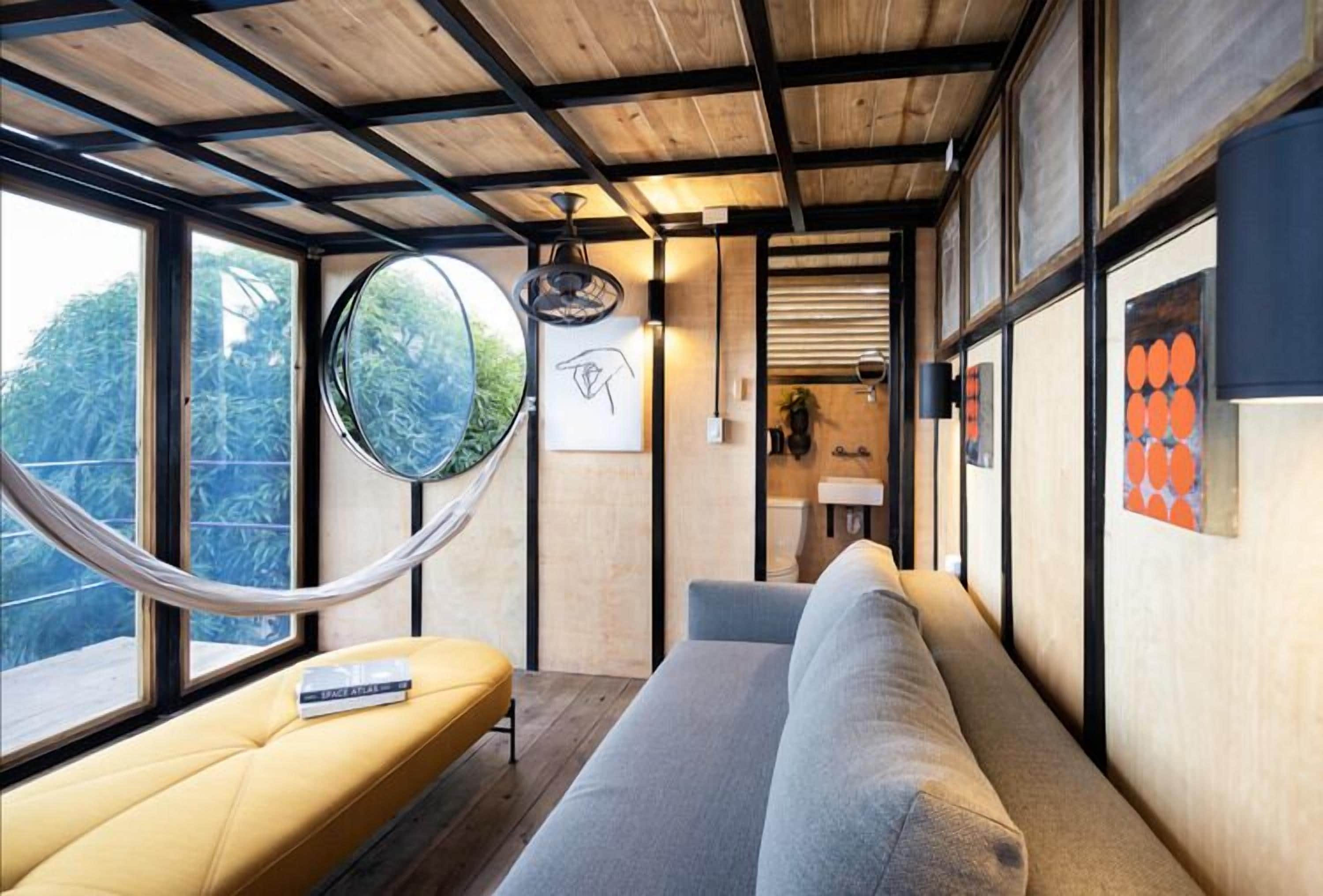 luxury tree house, 1 queen bed, kitchen, ocean view | living area