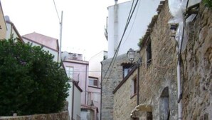 A narrow stone staircase leading up to a building with a traditional architectural style. - Apartment in villa with swimming pool in Cefalù, view of the bay, App. Aranancione (Cefalu)