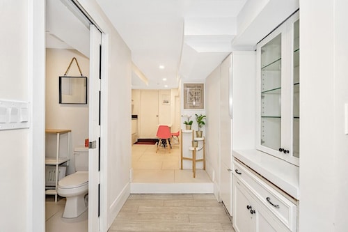 Clean, white, bright and close to Woodbine subway