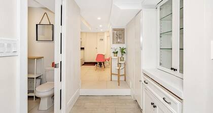 Clean, white, bright and close to Woodbine subway
