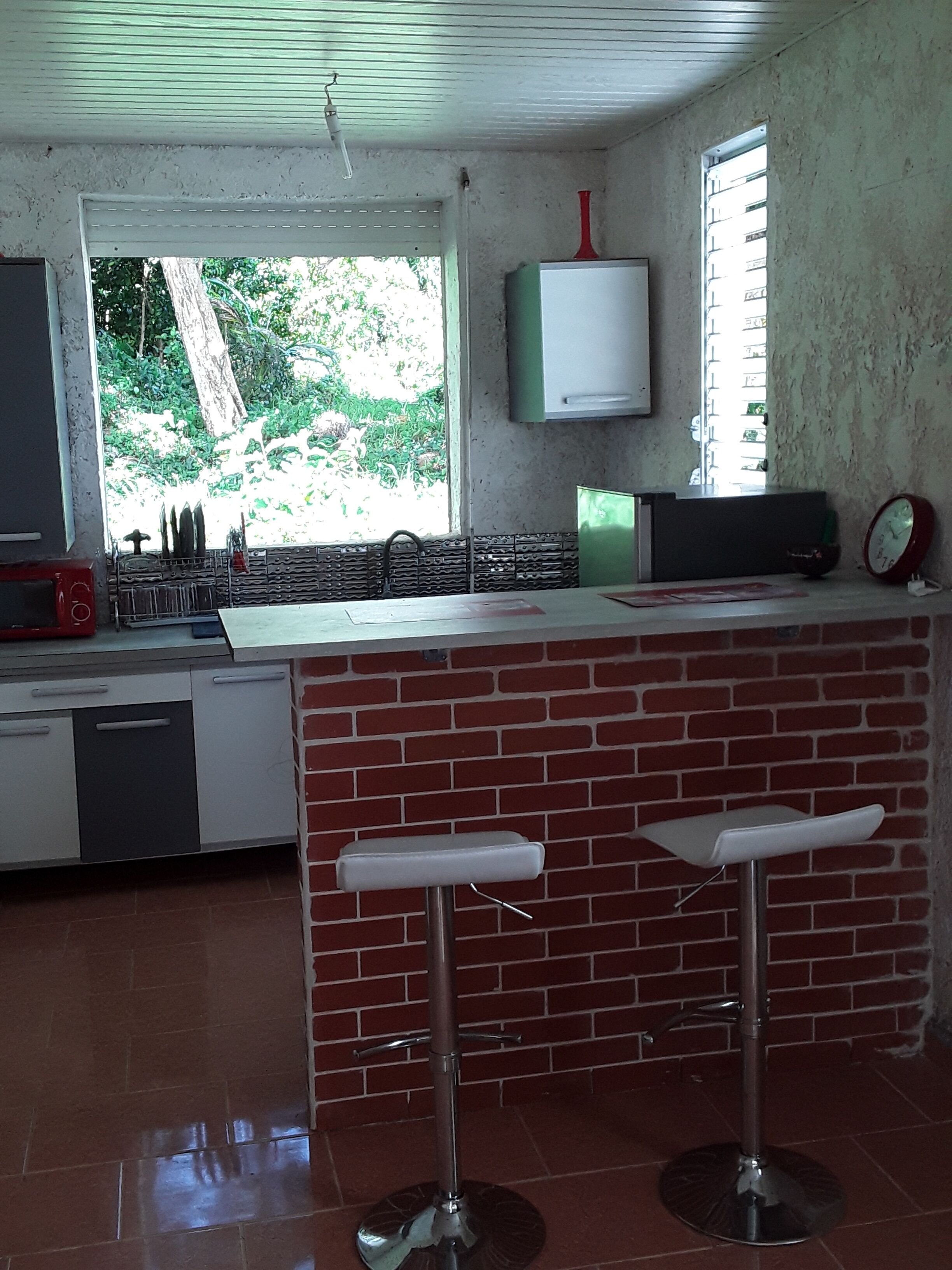 Fridge, microwave, coffee/tea maker, cookware/dishes/utensils