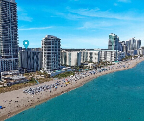On the beach, sun loungers, beach towels