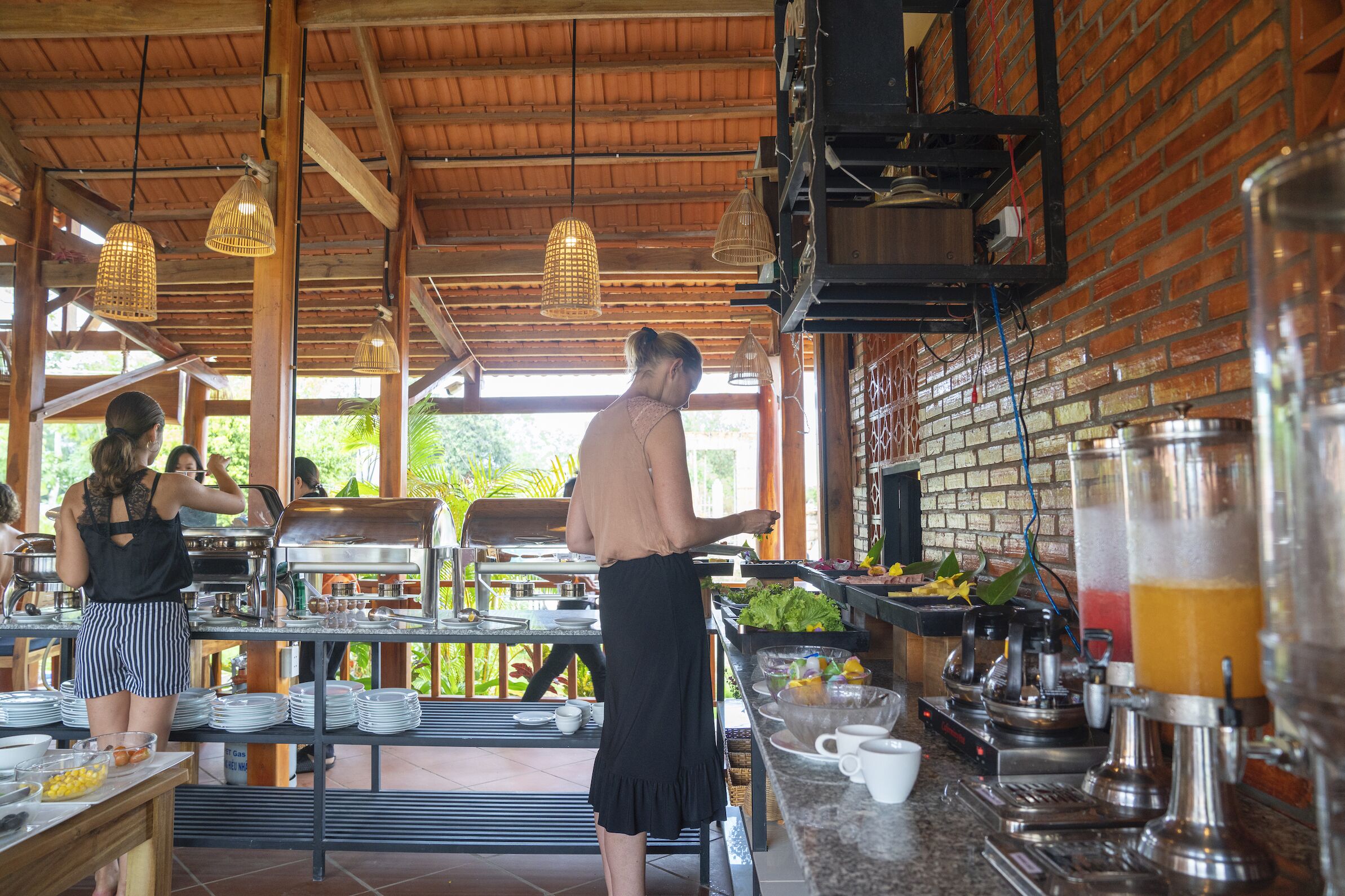 A buffet setup with multiple food stations and a beverage bar.