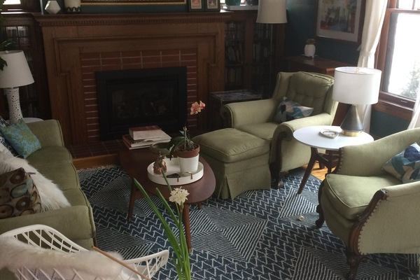 Living room, with fireplace and lots of windows