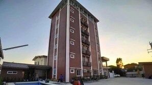 A multi-story residential building with a swimming pool in the foreground. - Avalon residence2 (Savannakhet)
