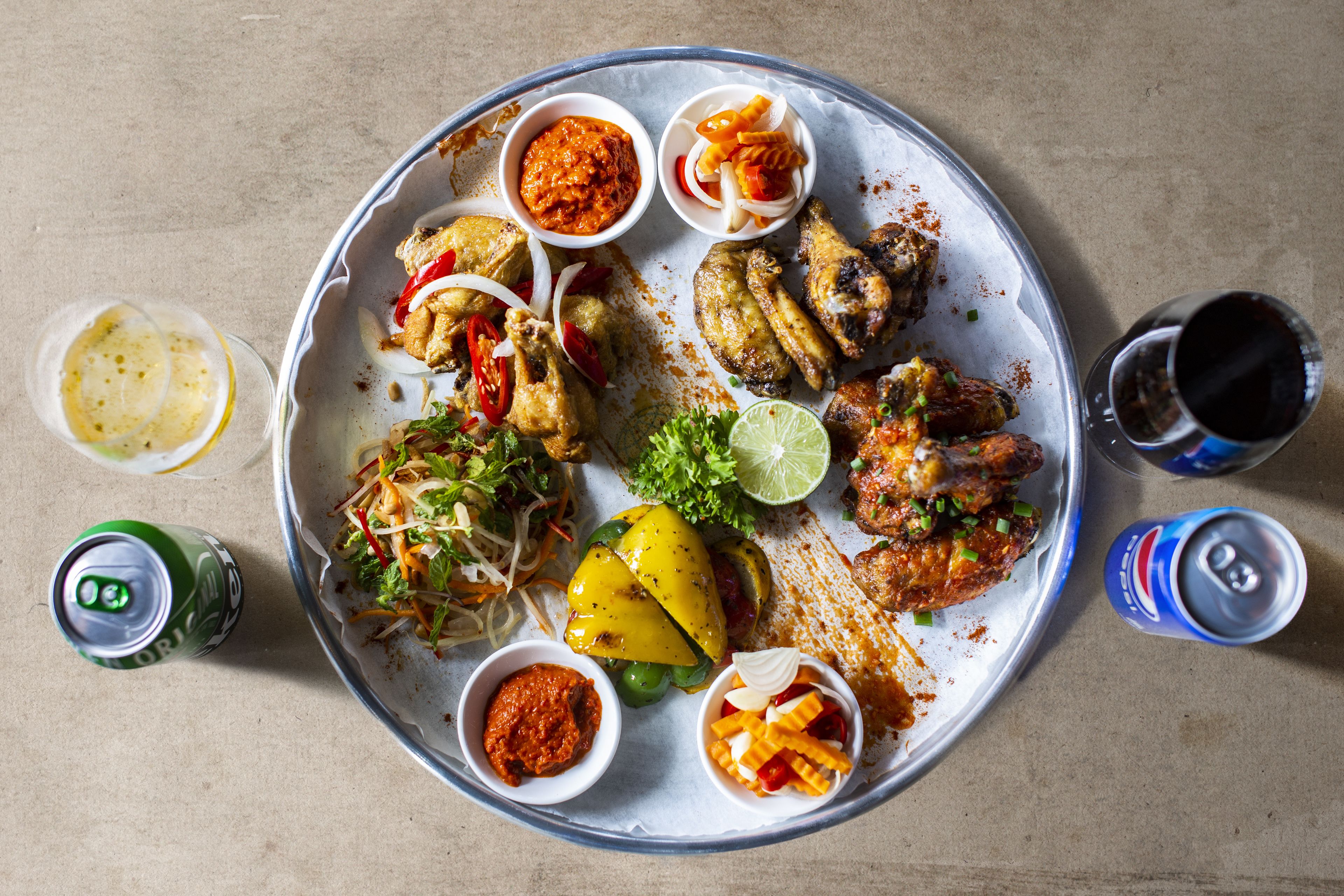A plate of food with various sides and condiments.