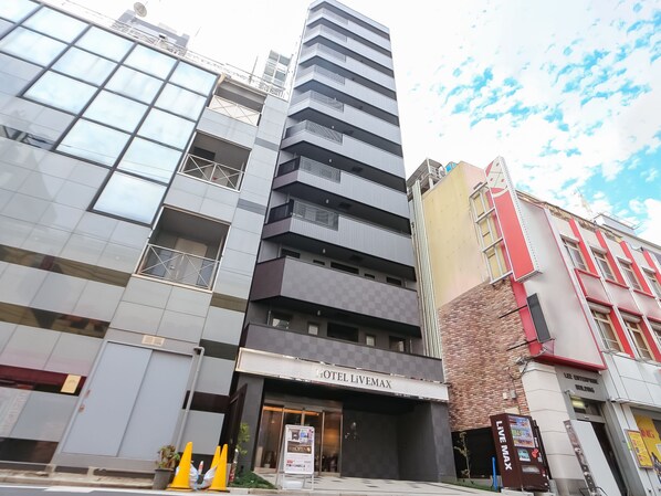 A hotel with a modern facade, multiple balconies, and a prominent entrance. - HOTEL LiVEMAX Akabane-Ekimae (Tokyo)