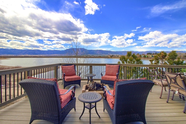 Deck overlooking Woodmoor Lake with gas fire pit.