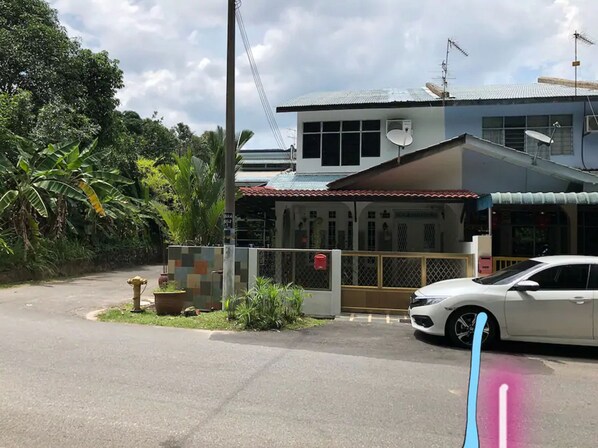 A two-story house with a car parked in the driveway. - Langkawi Destaz (Langkawi)