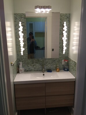 Combined shower/tub, hair dryer, towels, soap