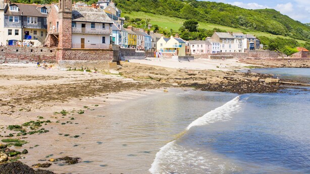 A coastal town with a prominent clock tower, colorful buildings, and a beach. - Eventide - Three Bedroom Cottage, Sleeps 5 (Kingsand)