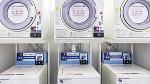 Three identical machines with control panels and a label in a foreign language. - HOTEL LiVEMAX  Nagoya Taikodori-Guchi (Nagoya)