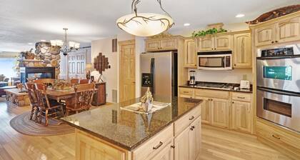 Waterfront townhome with fireplace, private patio, & shared boat docks