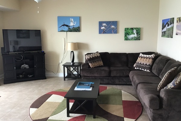 Large open concept living room with full lake view