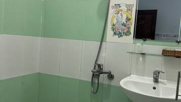 Shower, free toiletries, hair dryer, slippers