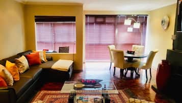 Penthouse, 3 Bedrooms, Sea View | Living room | 65-inch Smart TV with satellite channels, TV, fireplace