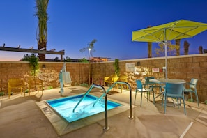 A pool area with a hot tub, outdoor seating, and a pergola. - Homewood Suites by Hilton Chula Vista-Eastlake (Chula Vista)
