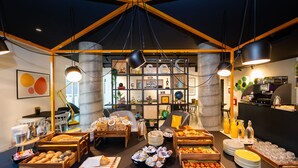 A breakfast buffet with various food items and a coffee station. - Staycity Aparthotels, Venice, Mestre (Mestre)