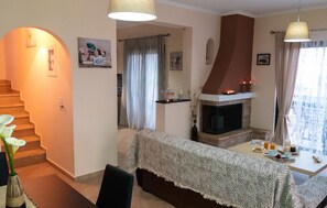 Villa, 2 Bedrooms, Sea View | Living room | Flat-screen TV, fireplace - Elina's House (Xylokastro-Evrostina)
