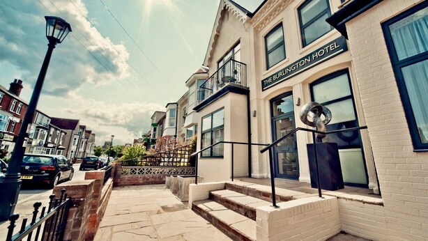 A corner building with a sign reading "The Burlington Hotel". - The Burlington Hotel (Cleethorpes)