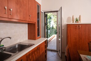 Apartment, 4 Bedrooms | Private kitchen | Fridge, oven, stovetop, coffee/tea maker - Ionian Grand by Checkin (Corfu)