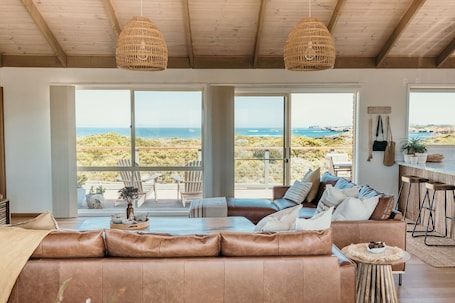 Smart TV, fireplace, books. Bay of Martyrs Sunsets - Coastal LuxuryBeach House