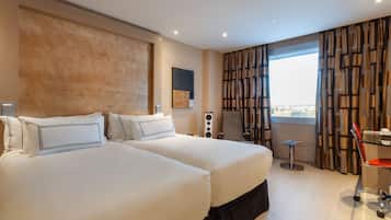 1 habitación, cubrecamas, minibar y caja de seguridad en la habitación