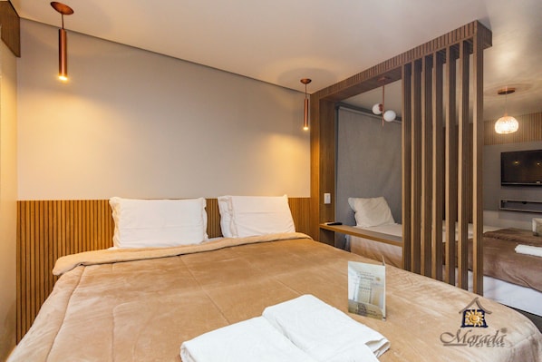 Deluxe Quadruple Room | Minibar, blackout drapes, free WiFi, bed sheets