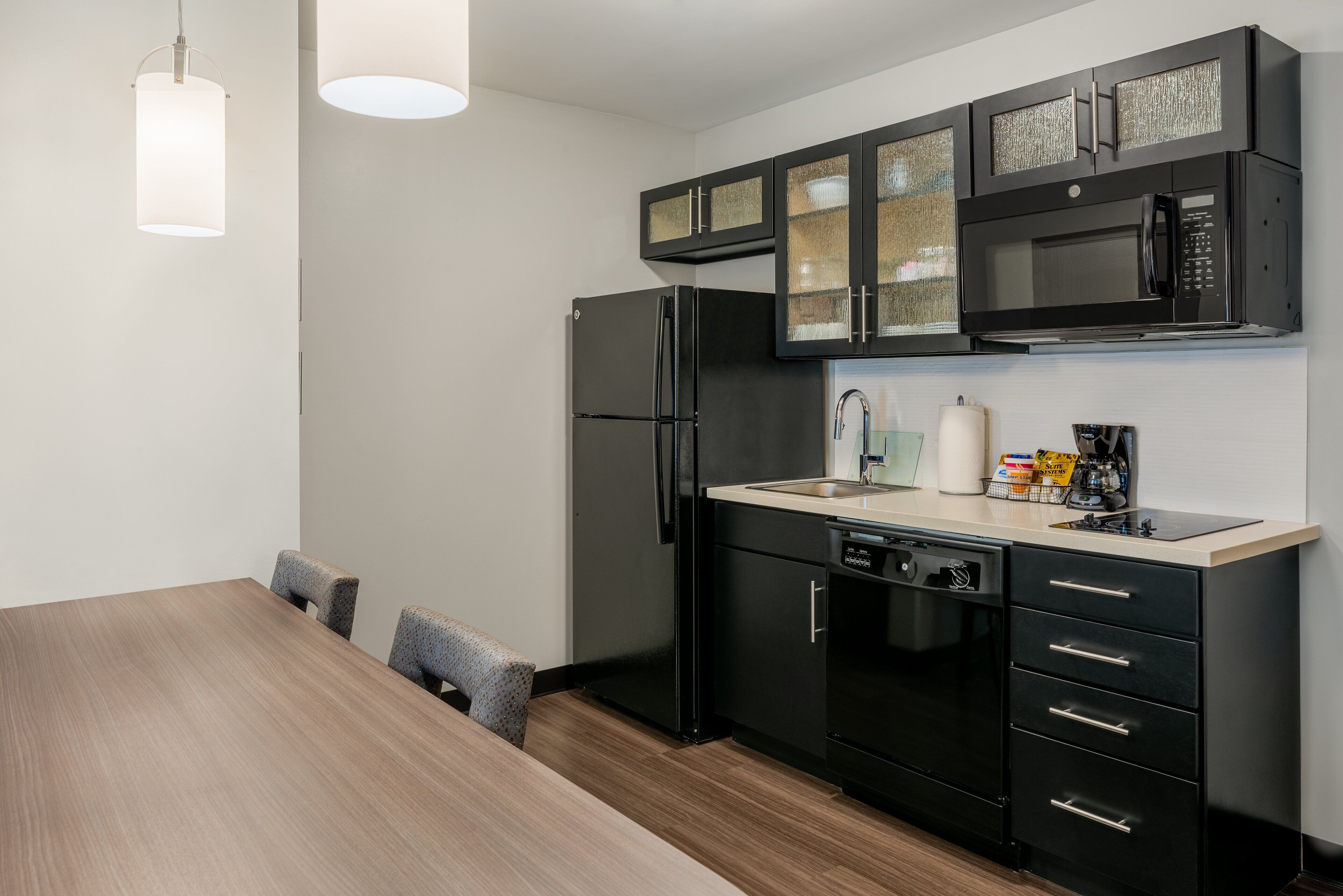 full-sized fridge, microwave, stovetop, dishwasher