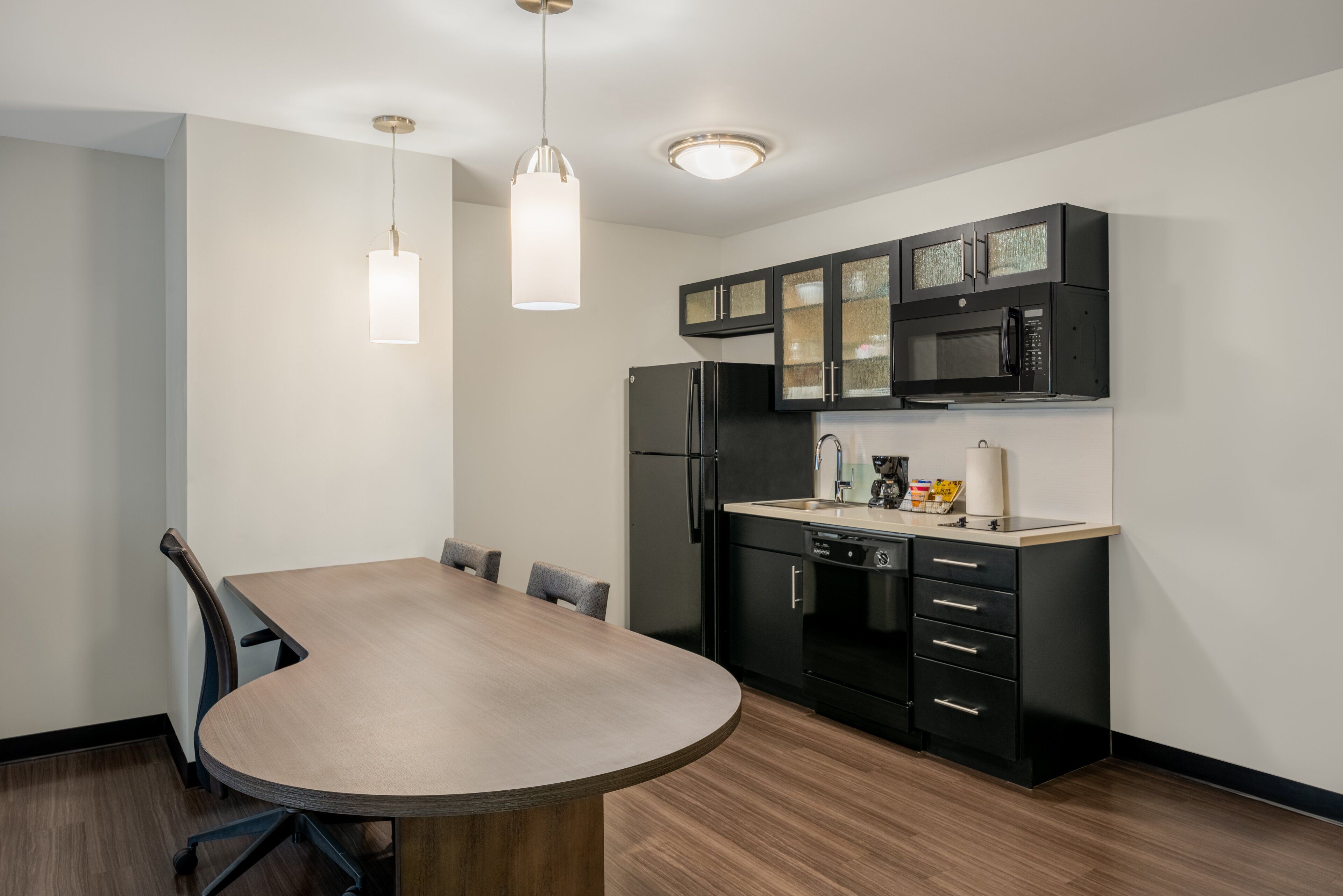 full-sized fridge, microwave, stovetop, dishwasher