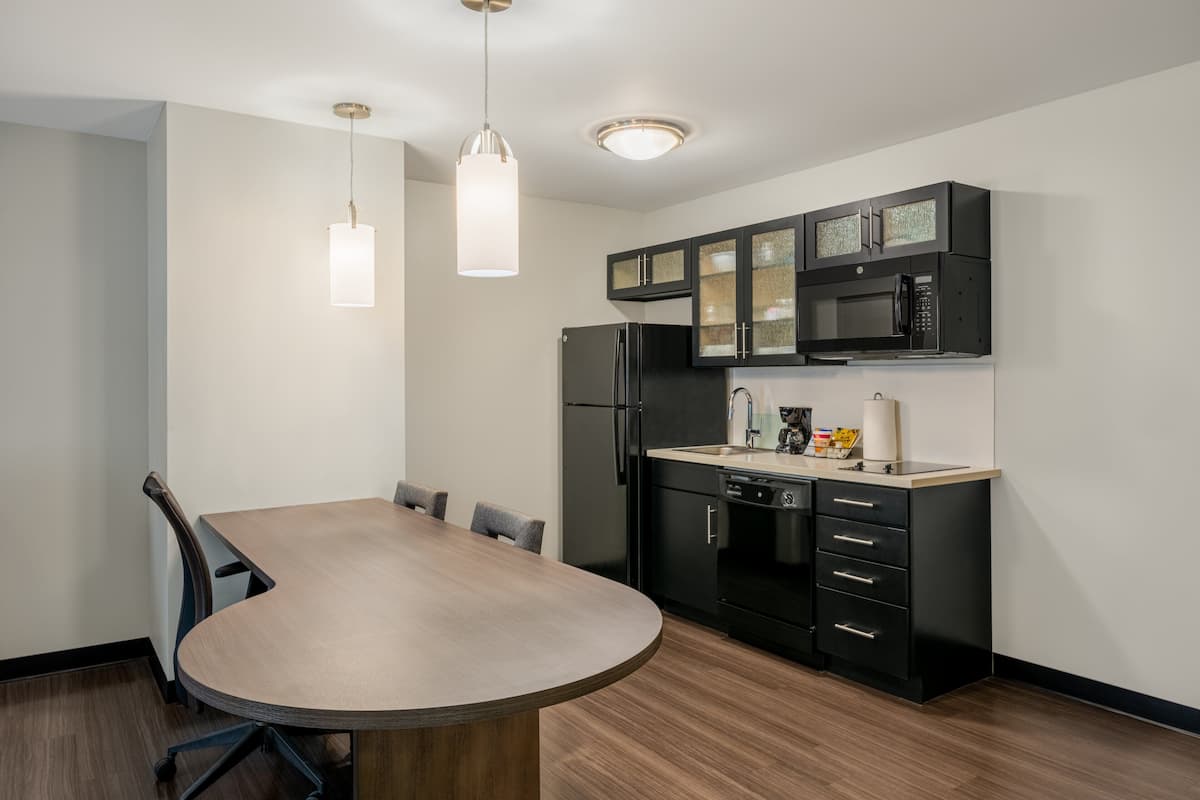 full-sized fridge, microwave, stovetop, dishwasher