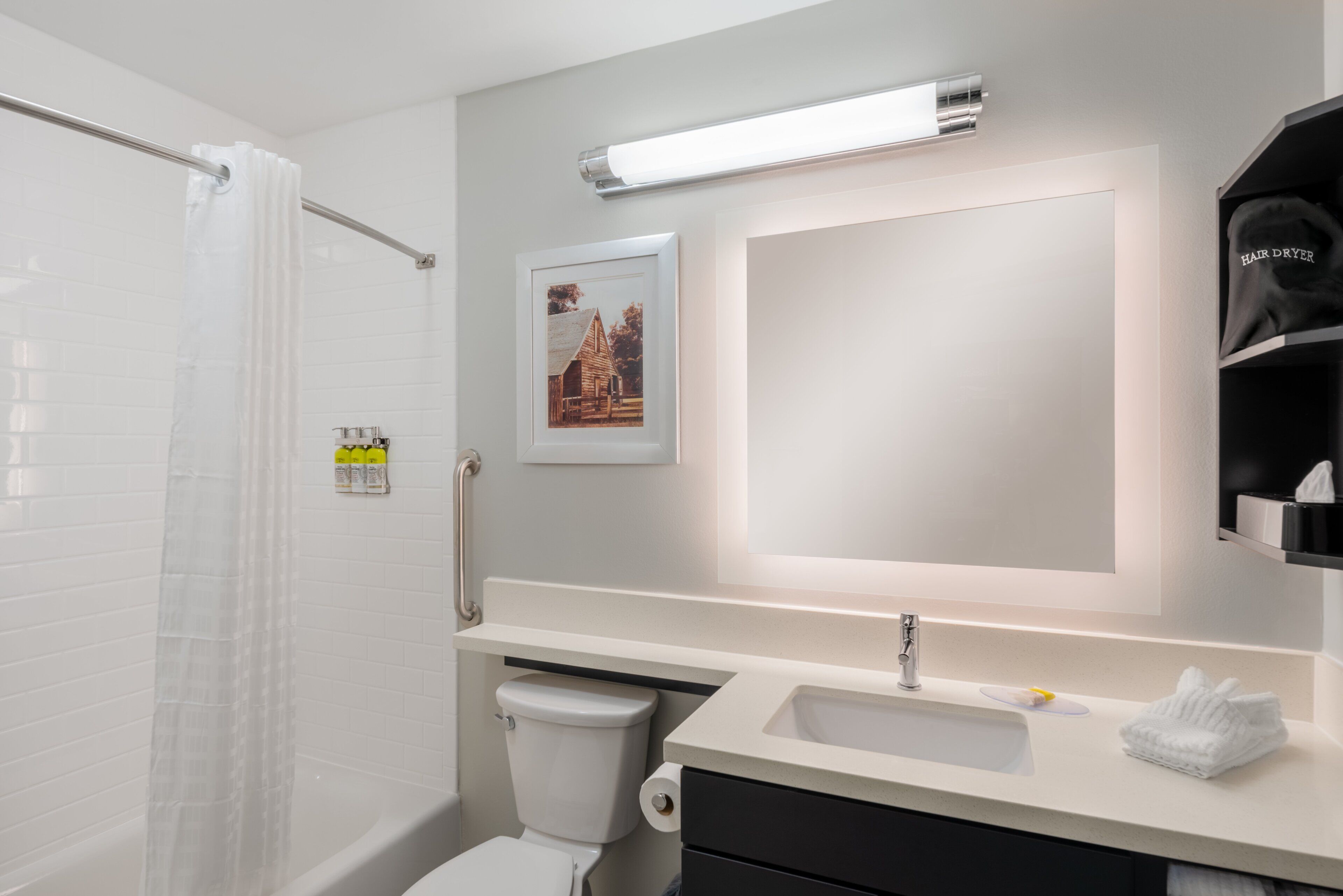 combined shower/bathtub, hair dryer, towels, soap