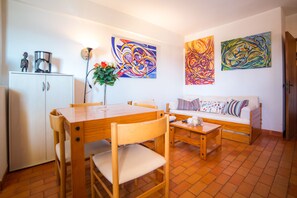 Departamento, 1 habitación | Área de sala de estar | Televisión de pantalla plana