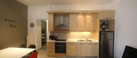 Apartment, 2 Bedrooms | Private kitchen | Full-size fridge, oven, stovetop, coffee/tea maker