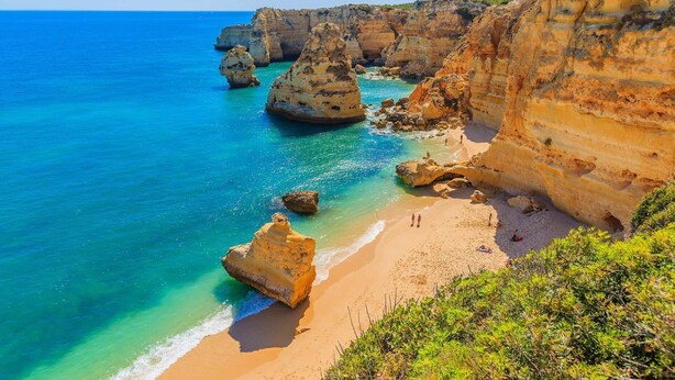 A coastal landscape with cliffs, clear blue sea, and a sandy beach. - A10 Windmill 1 Bed with Pool by Dreamalgarve (Lagos)