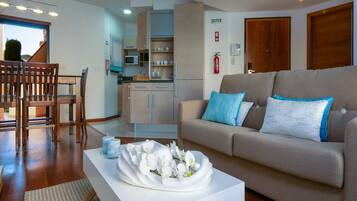 Apartment, 1 Bedroom, Ground Floor | Living area | Flat-screen TV
