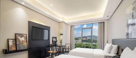 A modern hotel room with a large bed, a desk with a chair, a flat-screen TV, and a large window offering a city view.