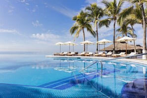 Outdoor pool, a heated pool - Perfect place to enjoy the dazzle of the ocean walk the beach and enjoy life. (Flamingos)