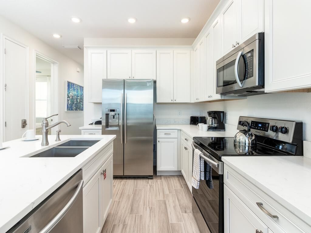 house, multiple beds, pool view (four-bedroom house) | private kitchen | full-sized fridge, microwave, oven, stovetop