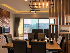 Three Bedroom Sea View #1 | Living room | 37-inch LED TV with digital channels, TV - Utopian Homes at IMAGO Mall (Kota Kinabalu)