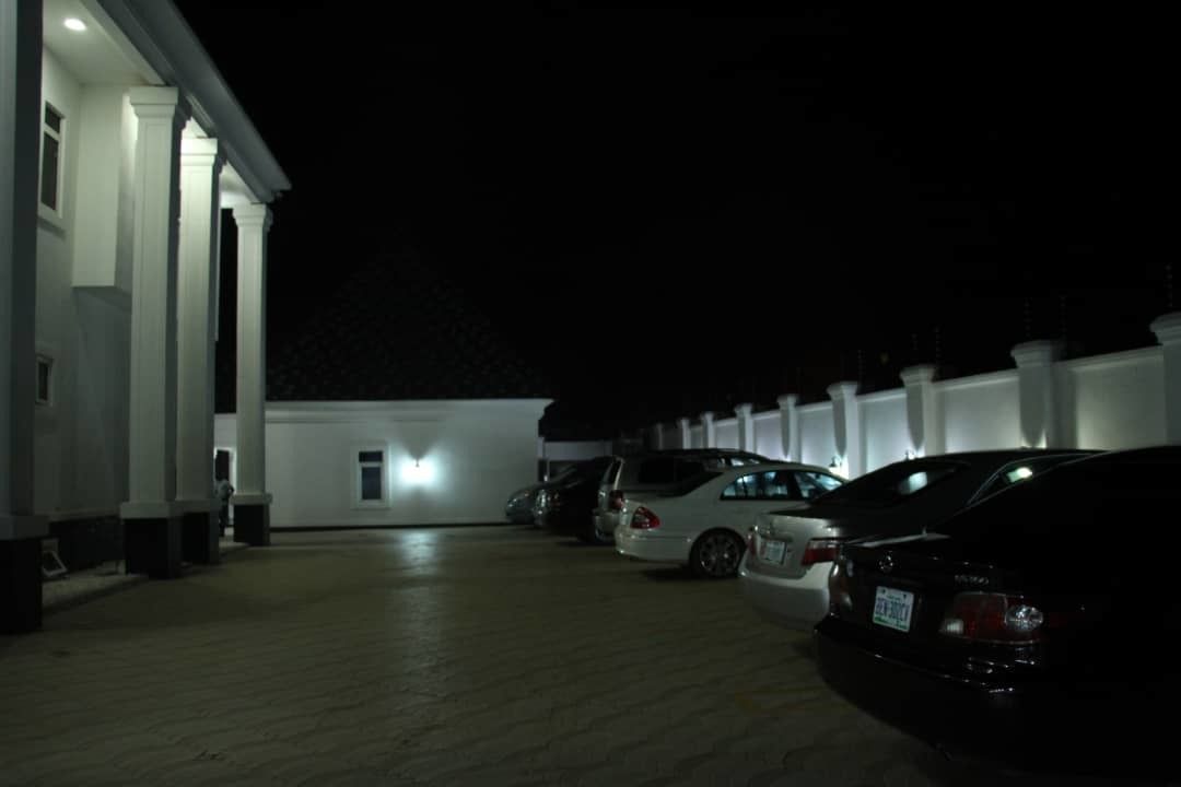 A parking garage with multiple cars parked.